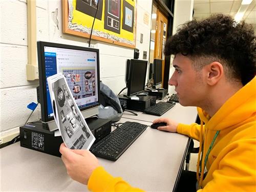 yearbook staff creating spreads for the yearbook 